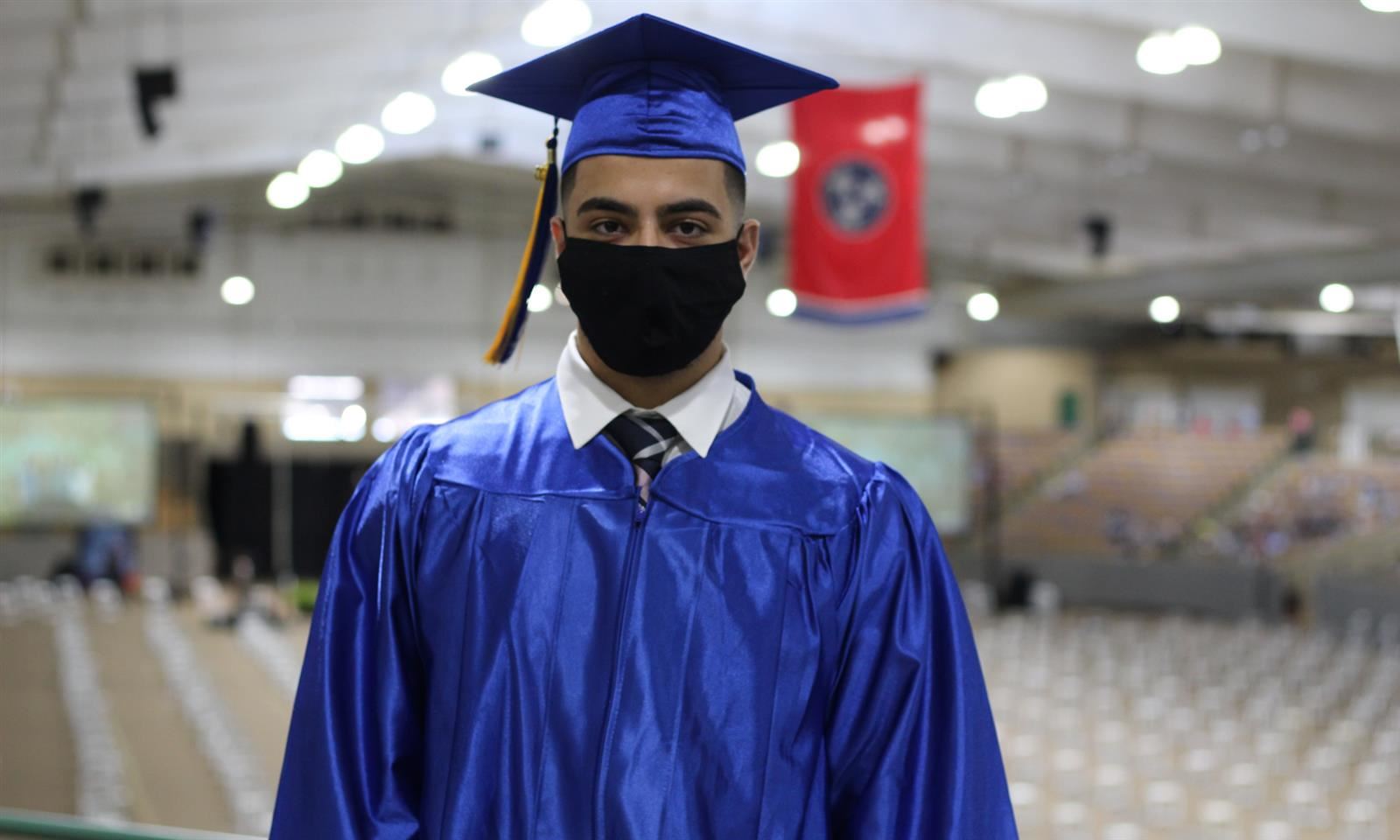 student in graduation robes 